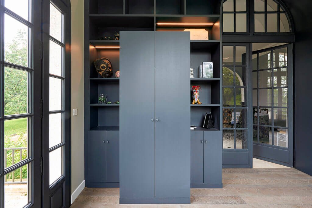 Entrance view showing bespoke bookcase and oak parquet flooring