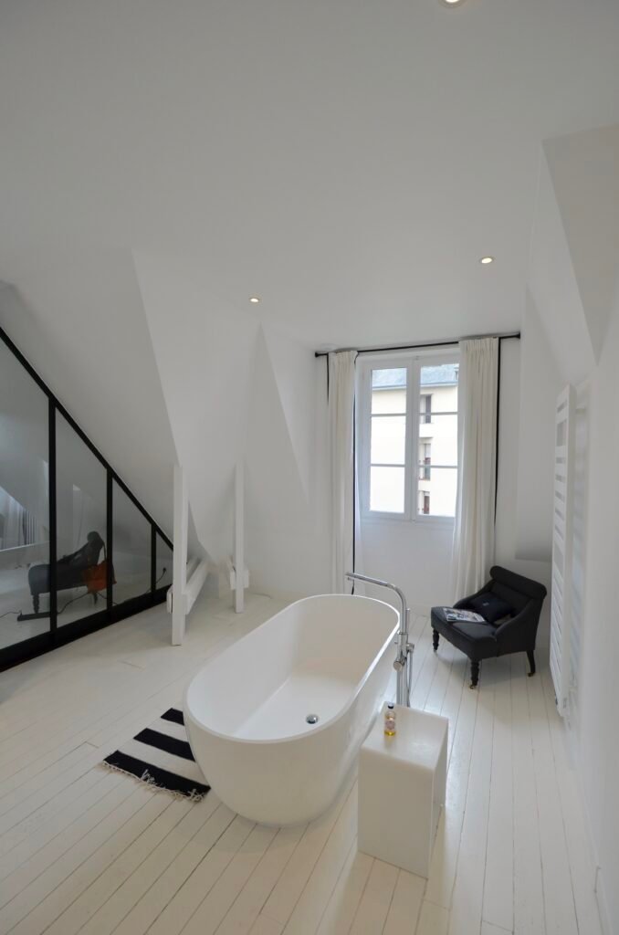 Primary bathroom integrated within the master suite of a private townhouse