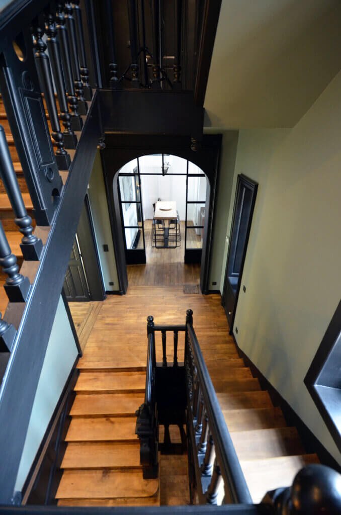 Central staircase and vertical circulation organizing all levels of a private townhouse